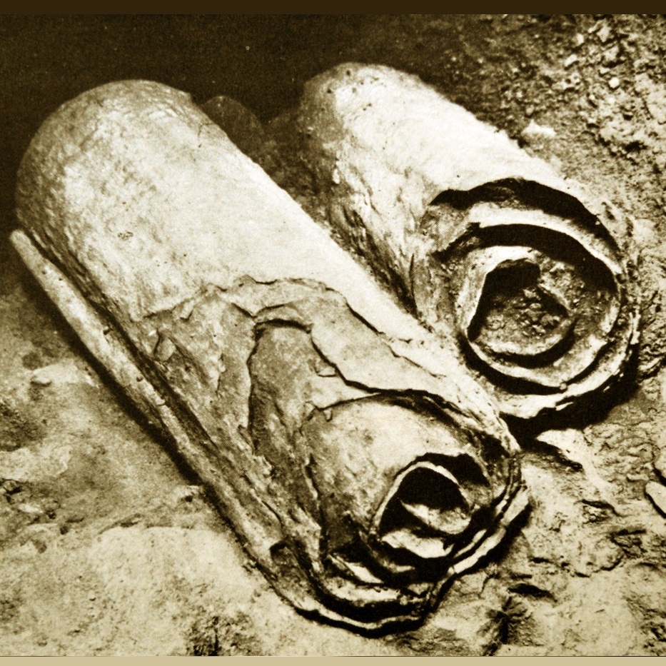 two thick scrolls falling apart from old age